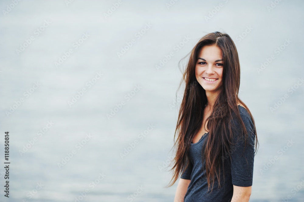 Portrait of charming girl with kind brown eyes, with a sincere s Portrait of charming girl with kind brown eyes, with a sincere s