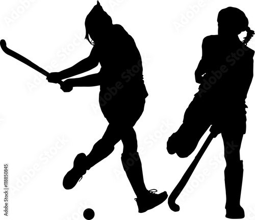 Silhouette of girl ladies hockey players hitting and blocking ba