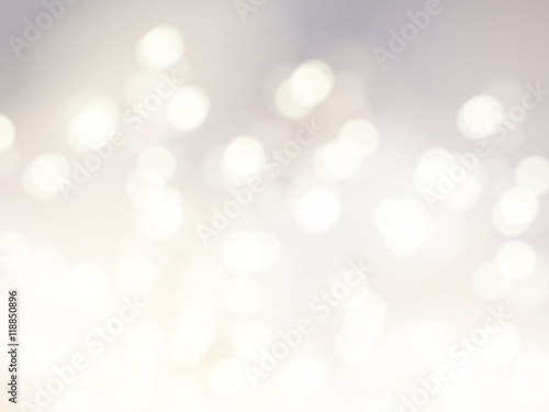 Vector bokeh background. Festive defocused white lights. Abstract blurred illustration.