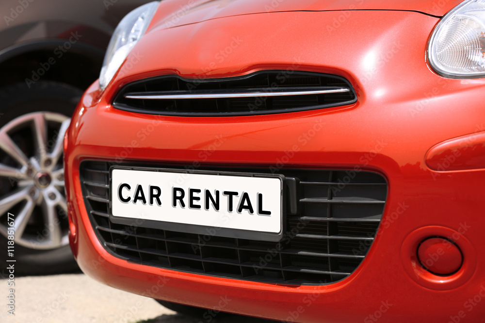CAR RENTAL. Closeup license plate at the in front of car