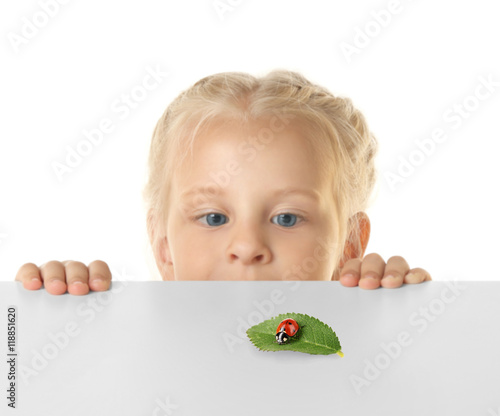 Funny little girl hiding be...