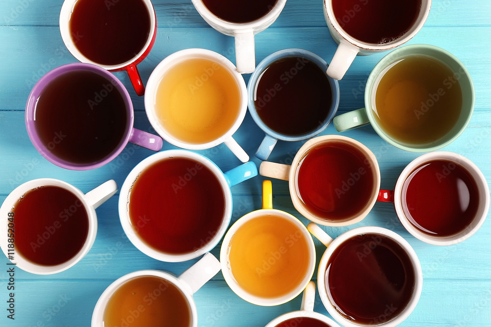 Cups of tea on table, top view
