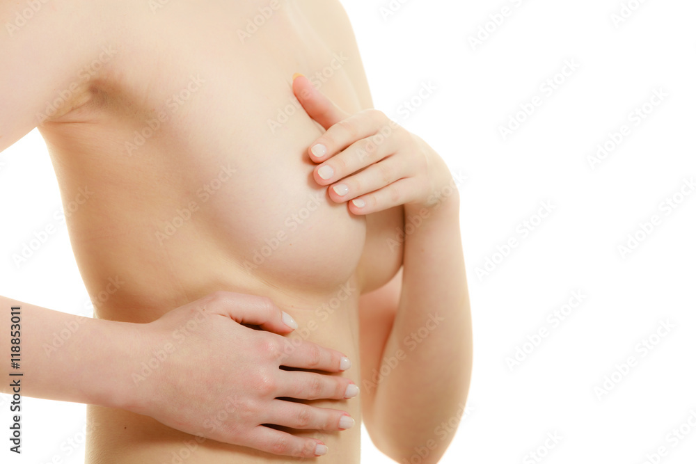 Woman examining her breasts for breast cancer Woman examining her breasts for breast cancer