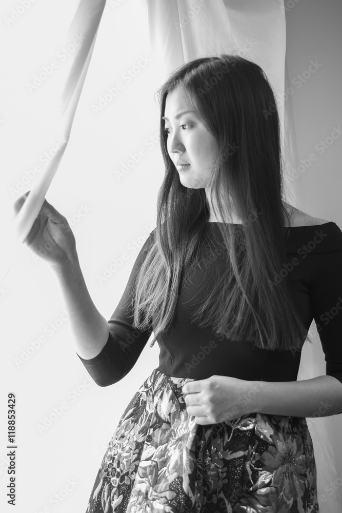Japanese Korean the girl standing at the window. Japanese Korean the girl standing at the window.