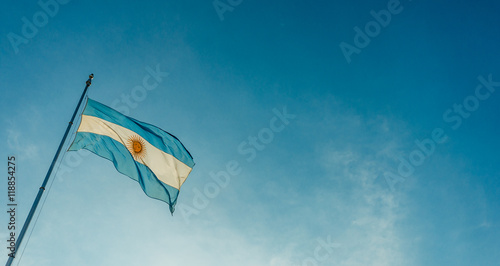 Argentina flag waving against blue sky on a sunny day 