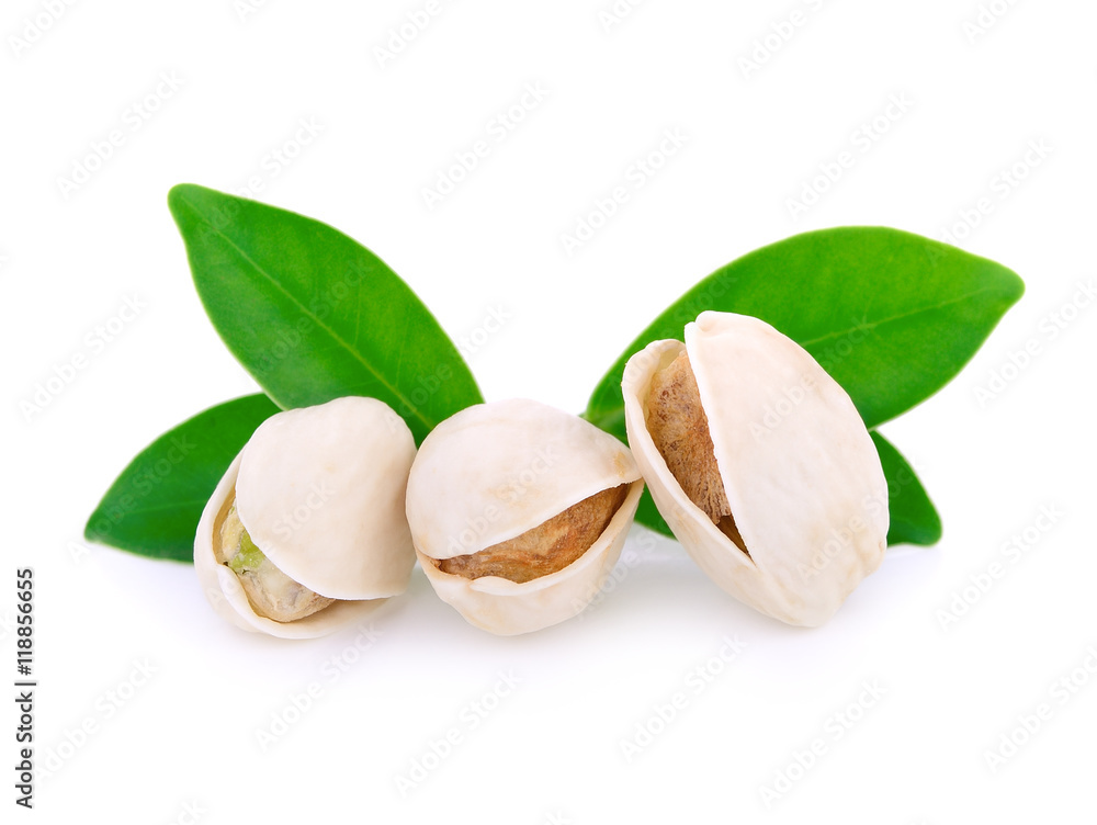 Pistachio nuts with leaf isolated on white Pistachio nuts with leaf isolated on white