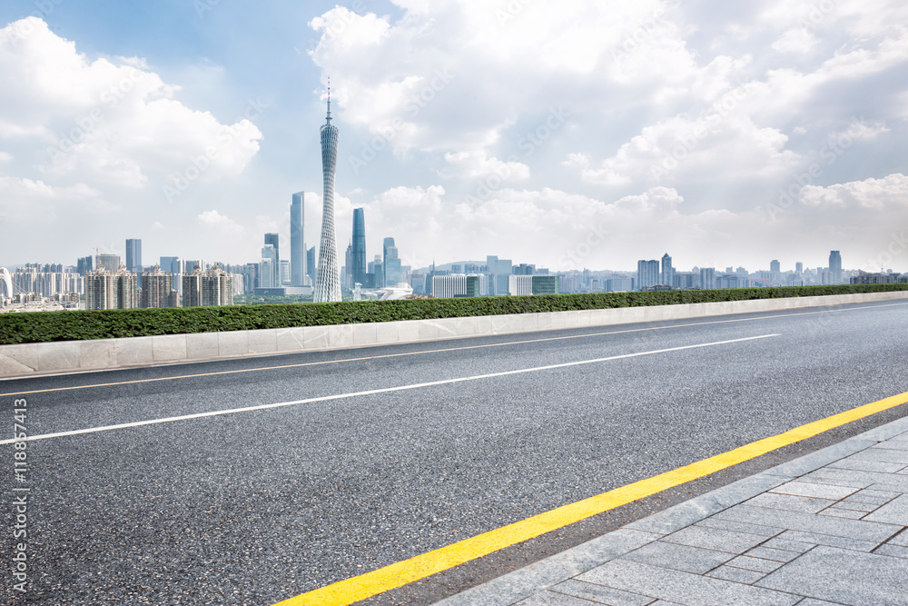 cityscape and skyline of guangzhou from empty asphalt road