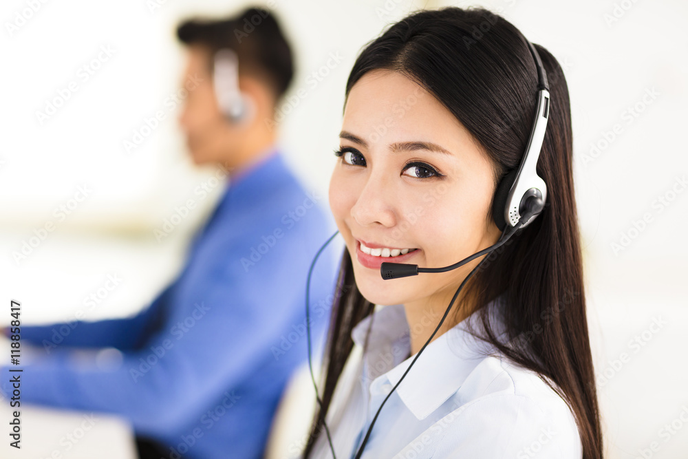 Beautiful call center agent working in office Beautiful call center agent working in office