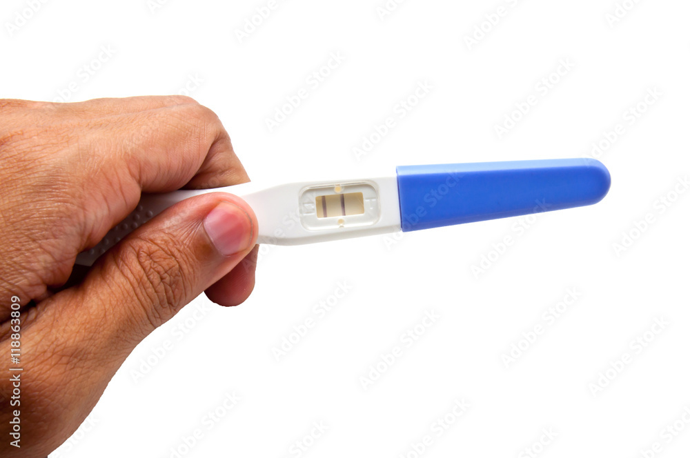 Positive pregnancy test result, hand holding pregnancy test Positive pregnancy test result, hand holding pregnancy test