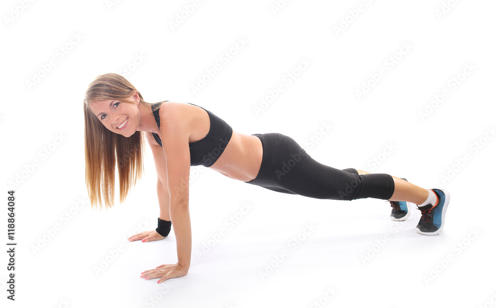 Athletic young woman practicing plank Athletic young woman practicing plank