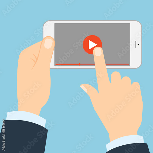 Smartphone with play button. Hands holding phone and touching play button. Concept of video, audio, internet and games.