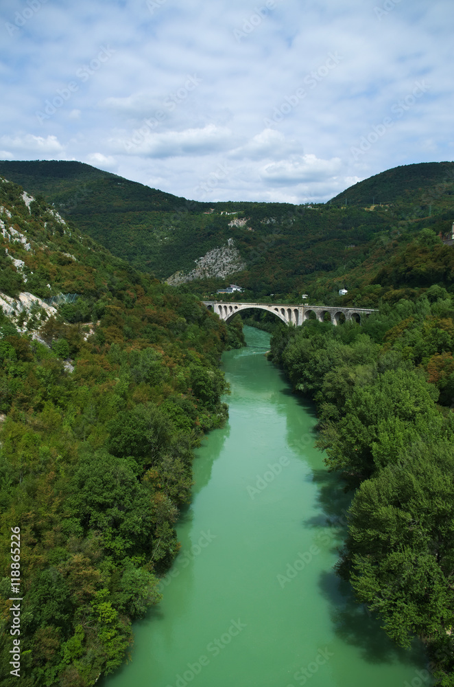 Isonzo (Soca) river and the stone Salcan bridge near Gorizia, border between Italy and Slovenia
