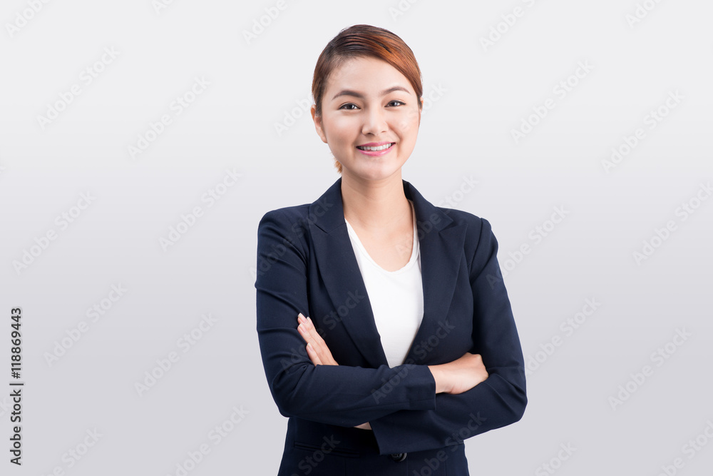 Beautiful asian young business woman on grey background. Beautiful asian young business woman on grey background.