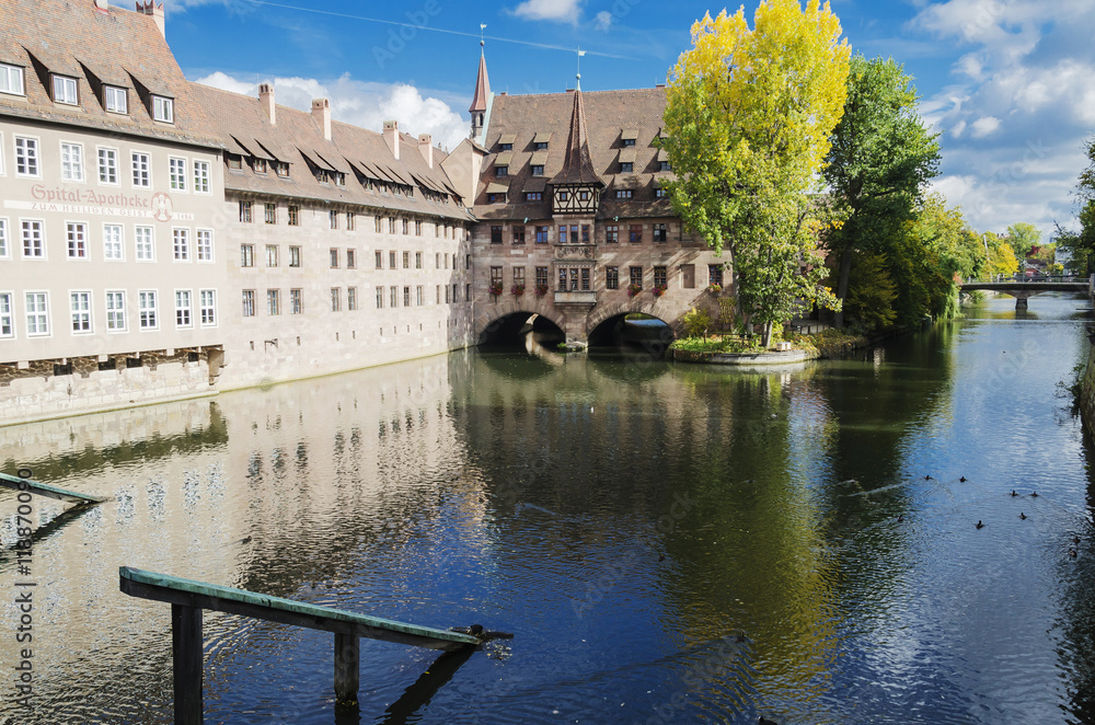 Naklejka premium Heilig-Geist-Spital or Hospital of the Holy Spirit, over the river Pegniz in Nuremberg, Germany