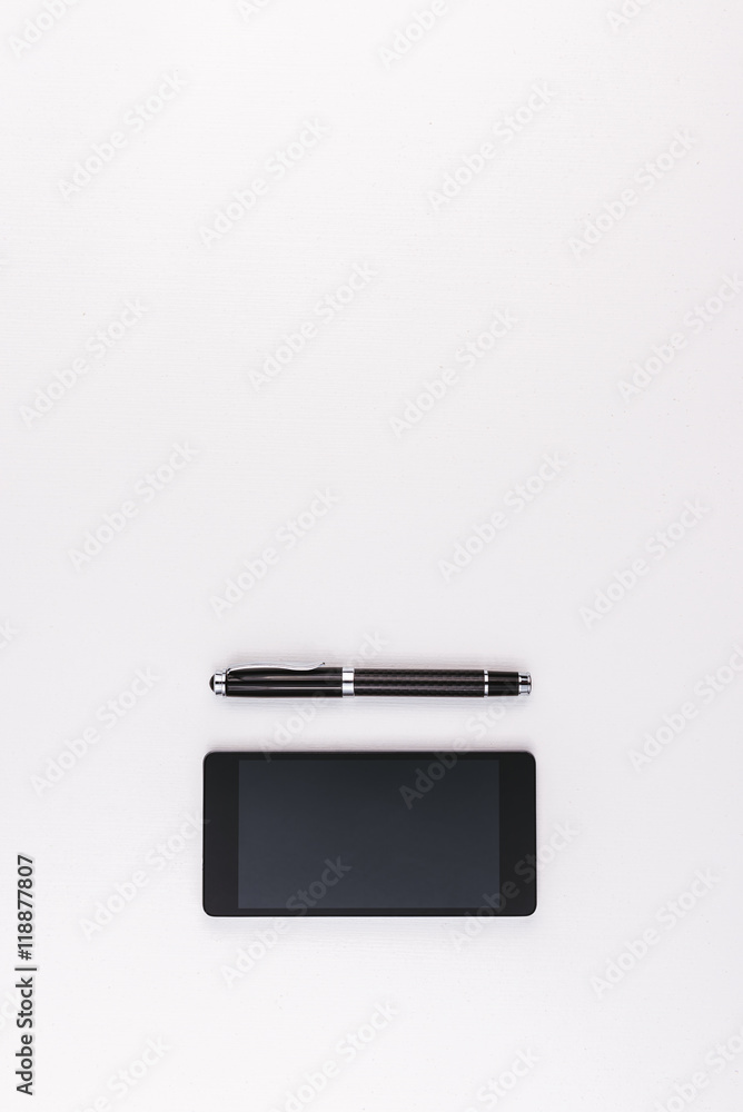 Mobile phone and pen on white background Mobile phone and pen on white background