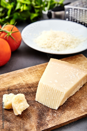 Piece of a parmesan and grated cheese