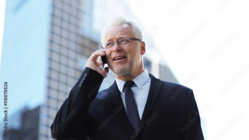 senior businessman calling on smartphone in city senior businessman calling on smartphone in city