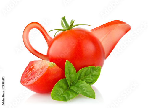 Creative conception tomato. Sauce-boat with branch of basil
