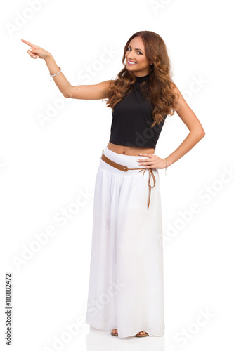 Smiling Woman In Long White Skirt Pointing