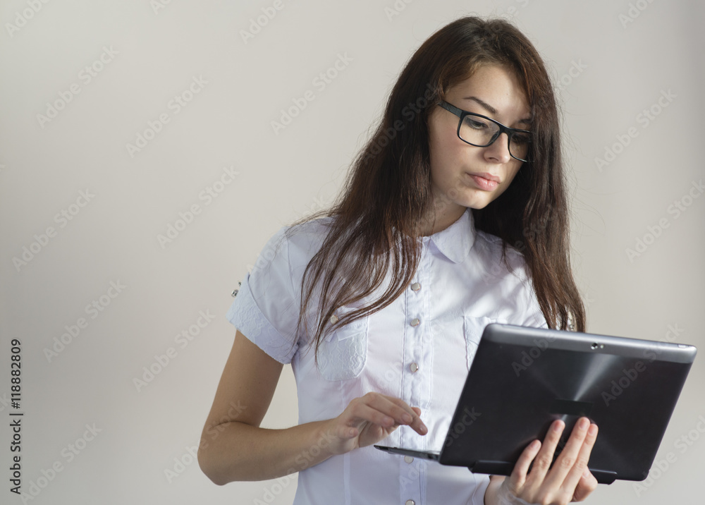 brunette in glasses and a white blouse with a laptop brunette in glasses and a white blouse with a laptop