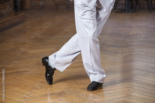 Low Section Of Dancer Performing Tango At Restaurant