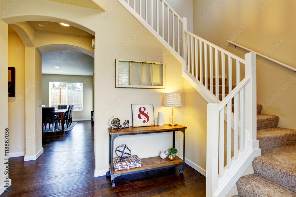 Fototapeta premium Hallway interior in beige tones and deep brown hardwood floor.