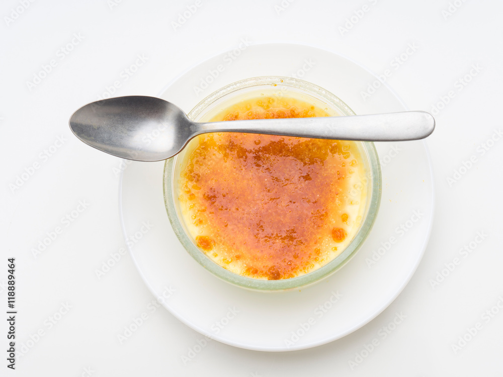 overhead shot spoon over burnt cream isolated overhead shot spoon over burnt cream isolated