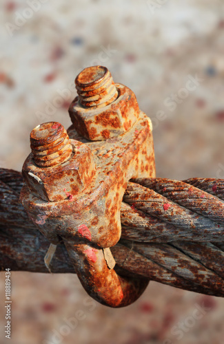 Rusty  wire grip lock  cable clamp turnbuckle with selective focus.