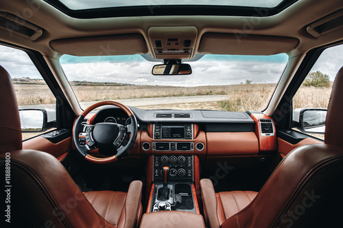 Modern interior of premium car with leather seats © Ivan Kurmyshov