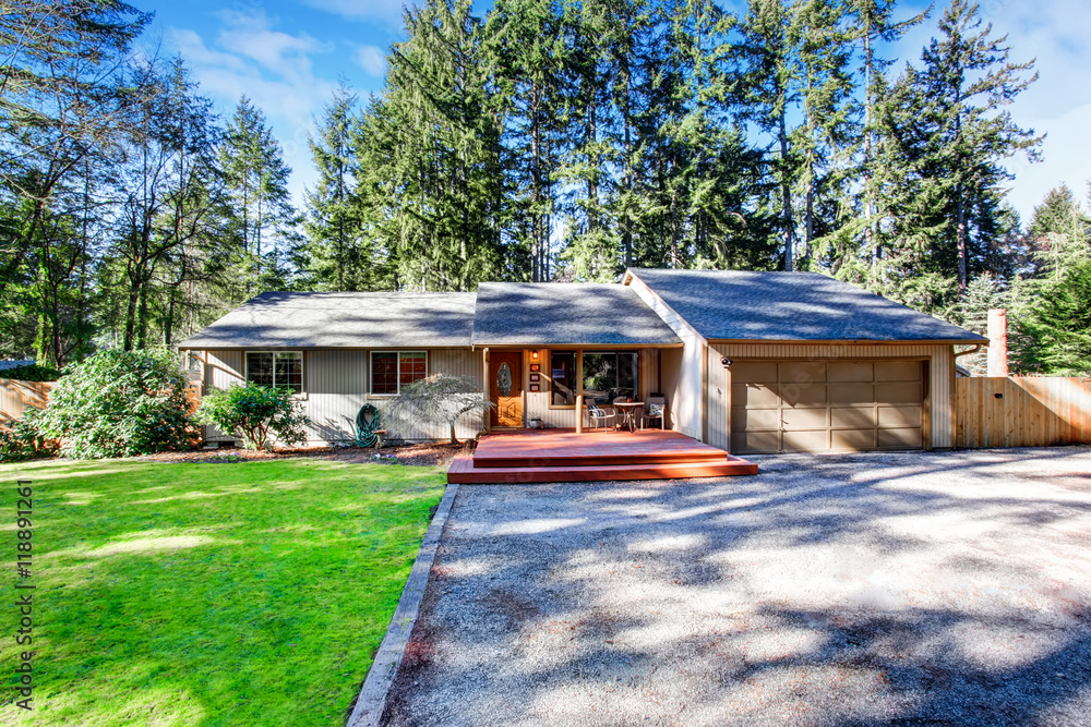 Grey house with wooden trim and gravel walkway. Curb appeal Grey house with wooden trim and gravel walkway. Curb appeal