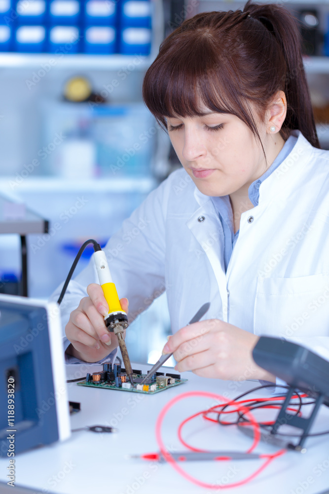 Young woman technician in phisics laboratory Young woman technician in phisics laboratory