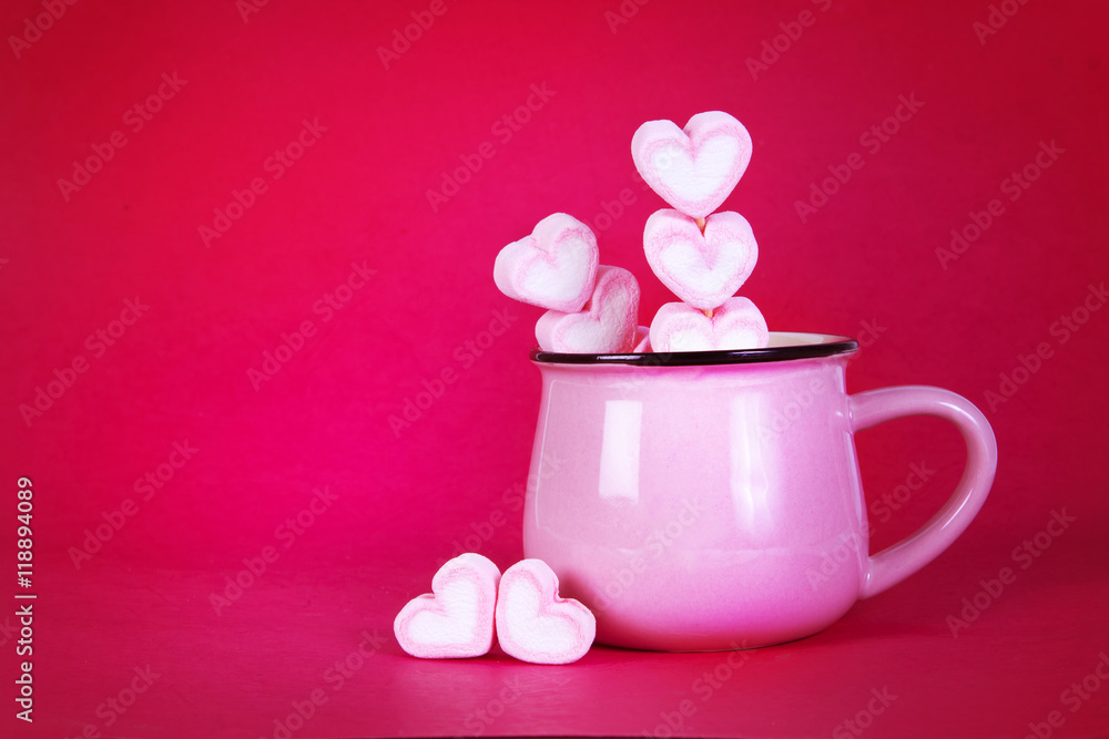 the marshmallow heart shape in cup on pink background with love the marshmallow heart shape in cup on pink background with love