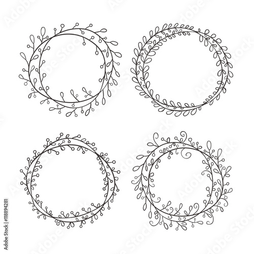Set of round frames, hand-drawn. Round frame made of branches with leaves and berries.  Wreath painted by hand.