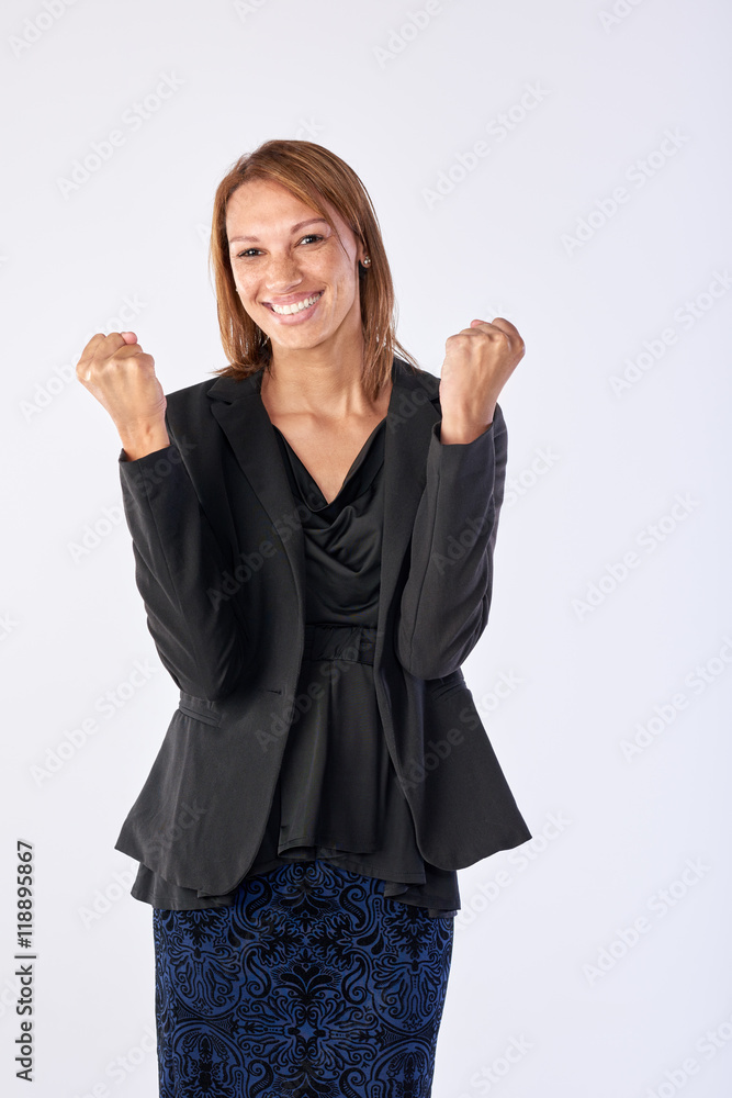 Mixed race woman celebrating in studio Mixed race woman celebrating in studio