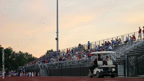 Dolly of fans in a high school stadium.