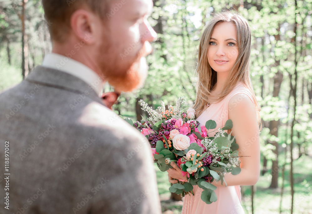 Look from groom's shoulder at stunning brown-haired bride admiri Look from groom's shoulder at stunning brown-haired bride admiri