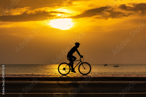 Man cycling at beach