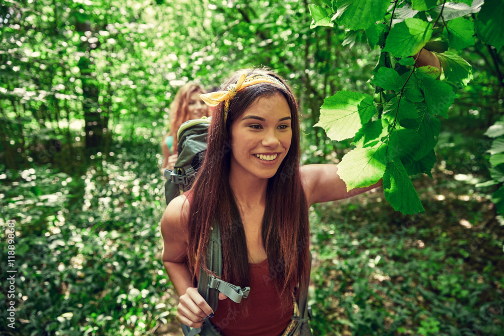 group of smiling friends with backpacks hiking group of smiling friends with backpacks hiking