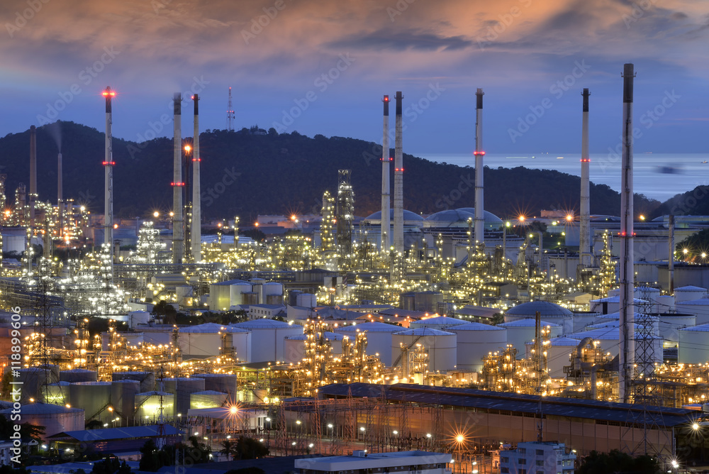 refinery plant at twilight .