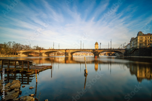 Amazing sunrise view at Vltava river bridge and boat with clear