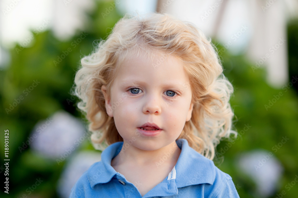 Beautiful boy three year old with long blond hair Beautiful boy three year old with long blond hair
