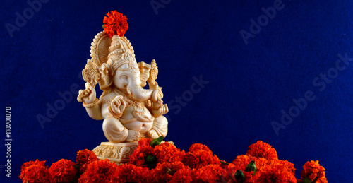 Hindu God Ganesha. Ganesha Idol on blue Background.

