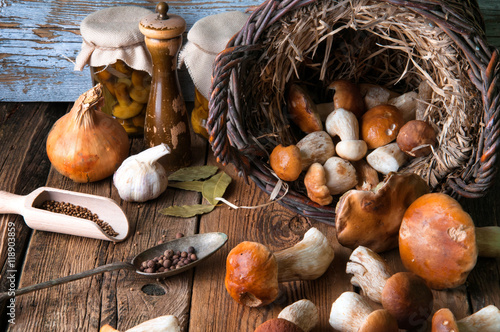 Fresh boletus in wicker basket in old rustic kitchen