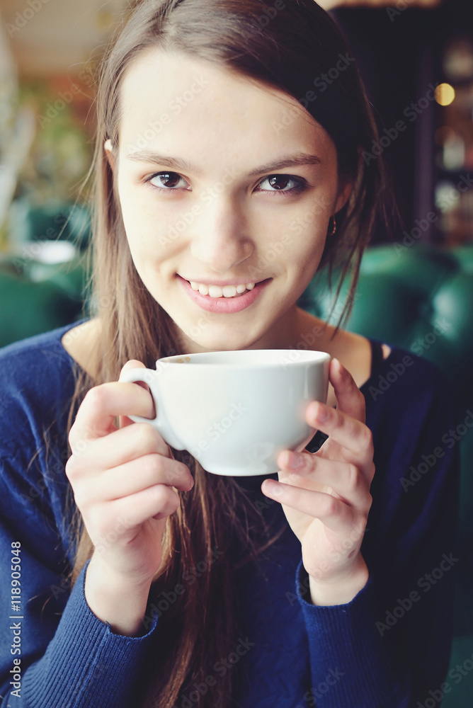young girl resting in a cafe