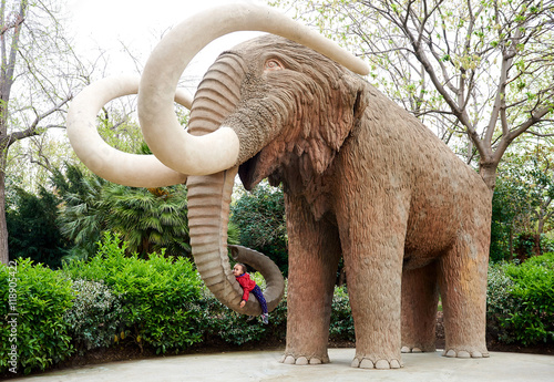 Photography Little girl lying on an elephant's proboscis. Barcelona. Spain