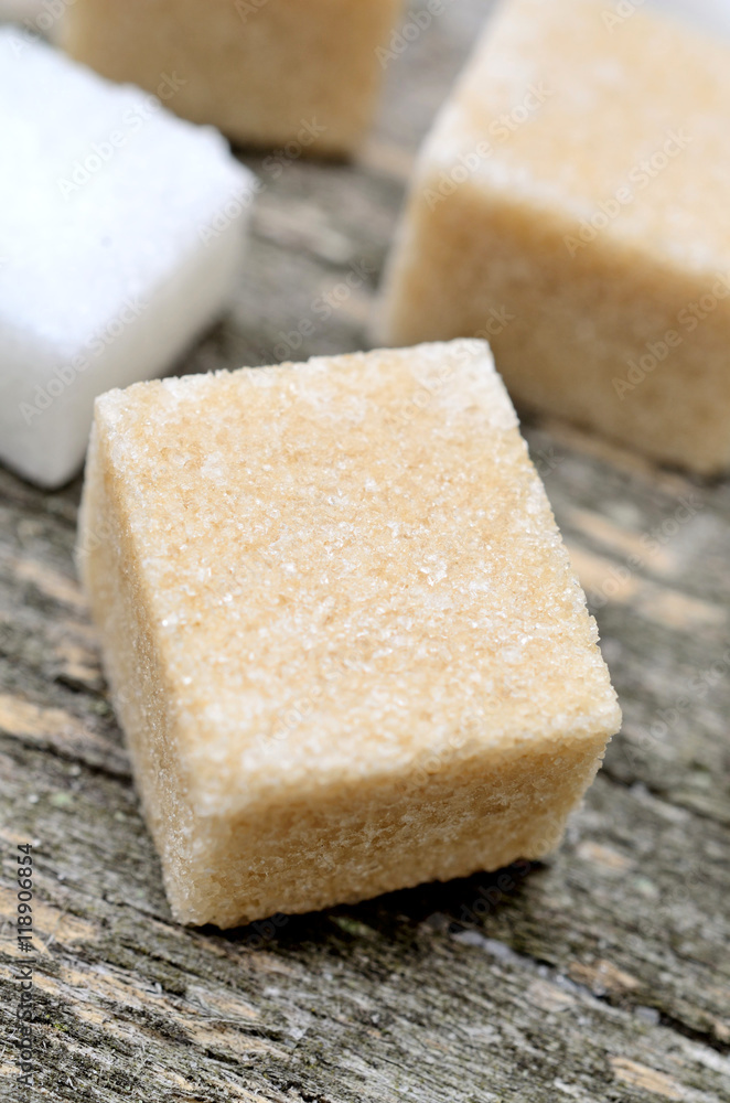 Sugar cubes on wooden table