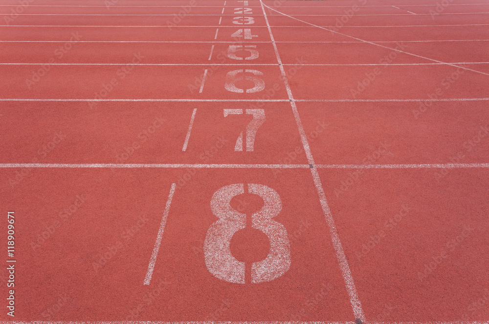 Starting lane with numbers on Red running track for athletics an