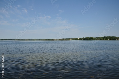 coastline of the lake under the blue sky