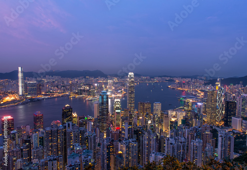 Hong Kong city skyline panorama at night with Victoria Harbor an