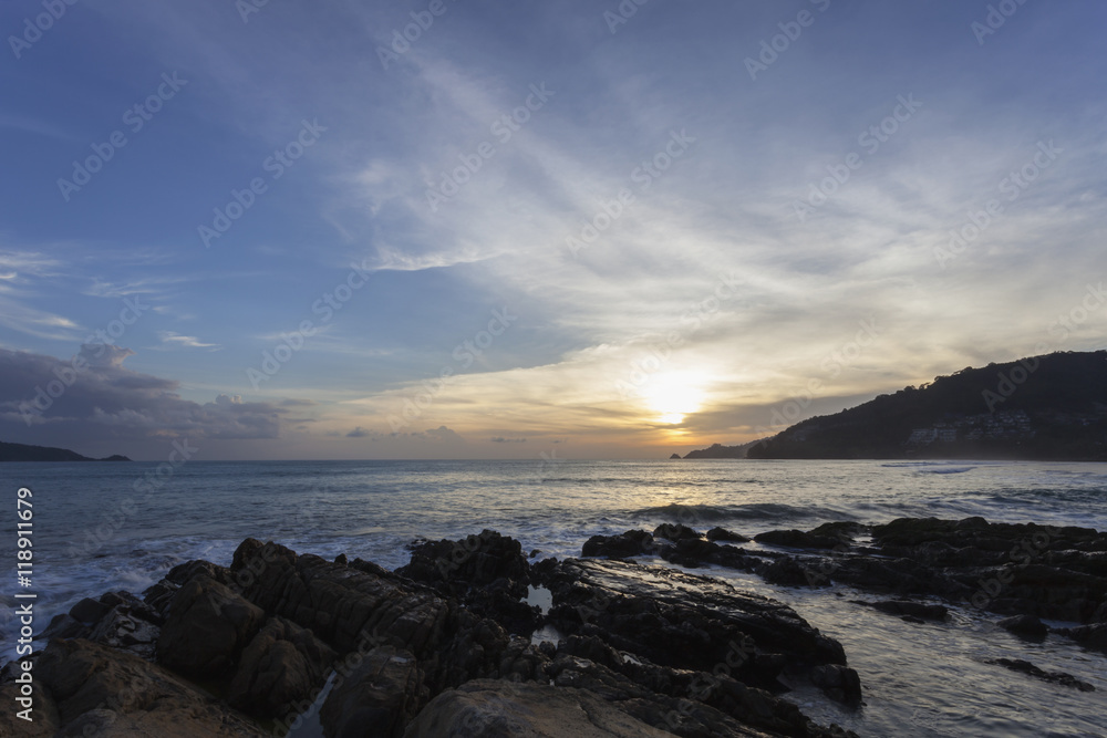 Fototapeta premium sea waves sand and rock in the twilight ,beautiful scenery for b